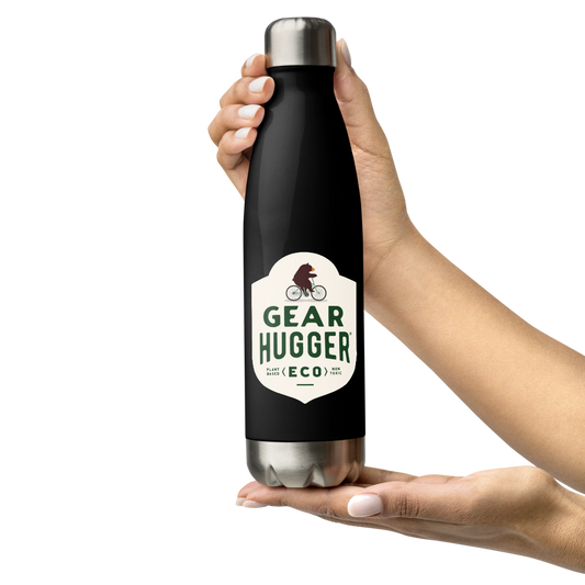 two hand holding an upright stainless steel water bottle with Gear Hugger text on it