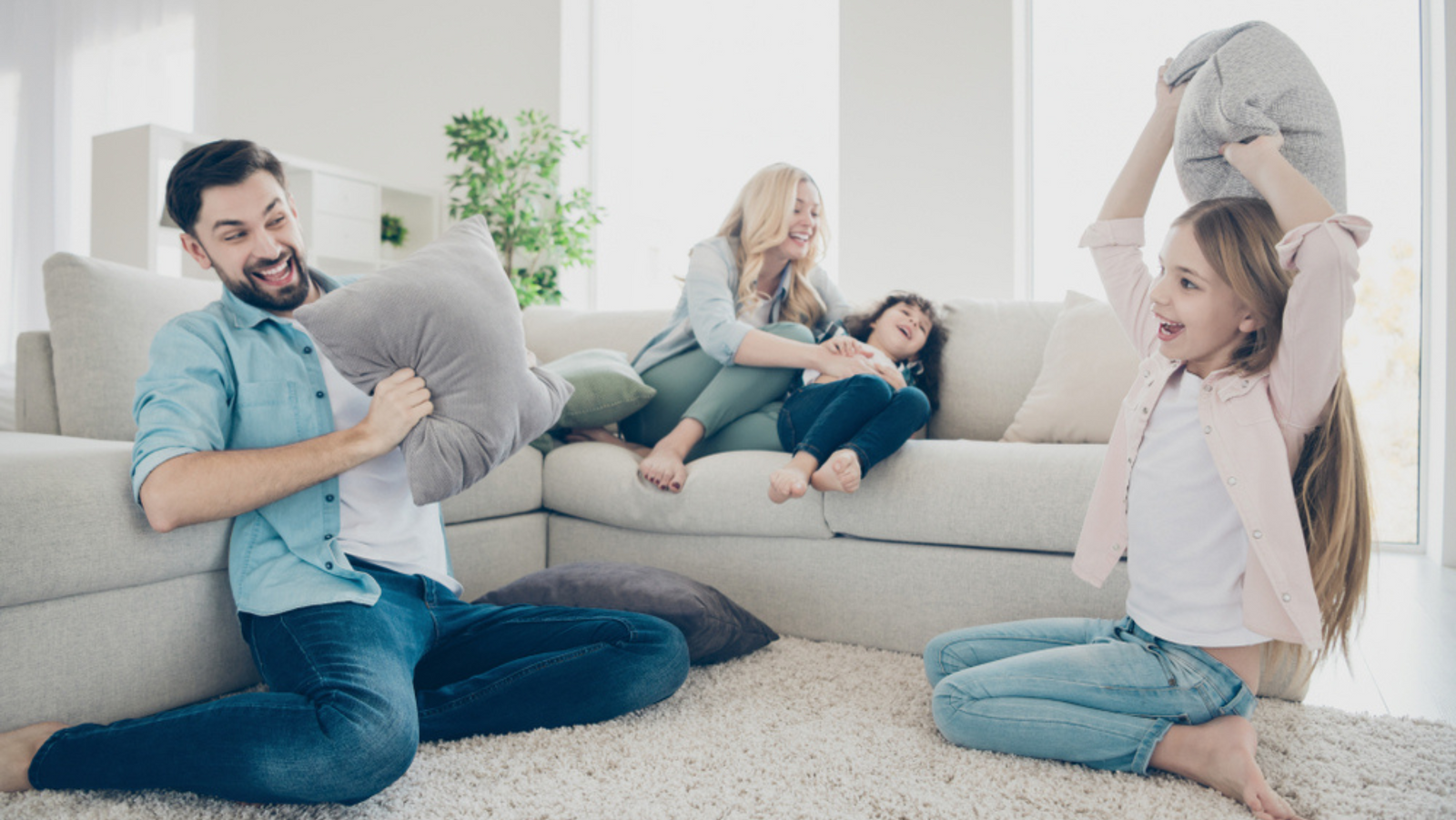 Family playing at home surrounded by everyday products containing Teflon PTFE chemicals
