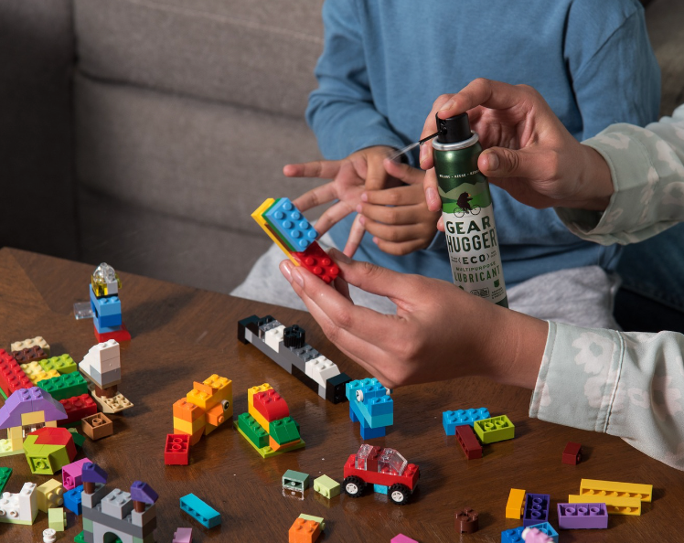 Using Gear Hugger eco-friendly lubricant to remove sticky goop and marks from toys