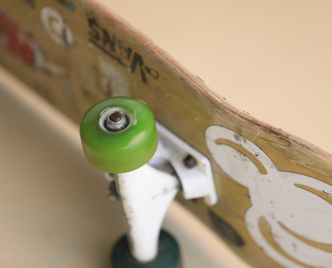 a skateboard wheel about to be greased