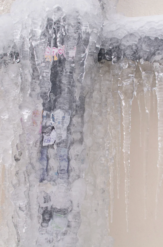 Frozen home water pipes covered in frost showing the need for winterization and protective coating