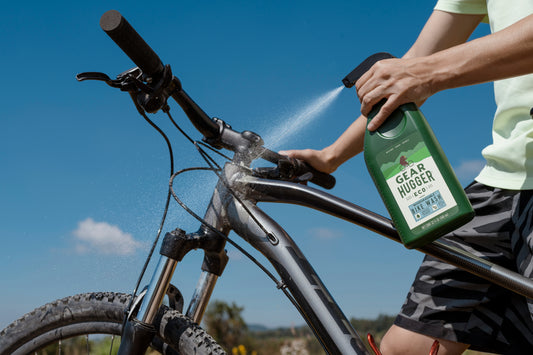 bike wash bottle container spraying handlebars on a bike