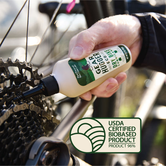 a man using greaser on his bike chain