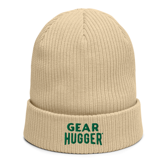 Beige coloured beanie with green text that says gear hugger.